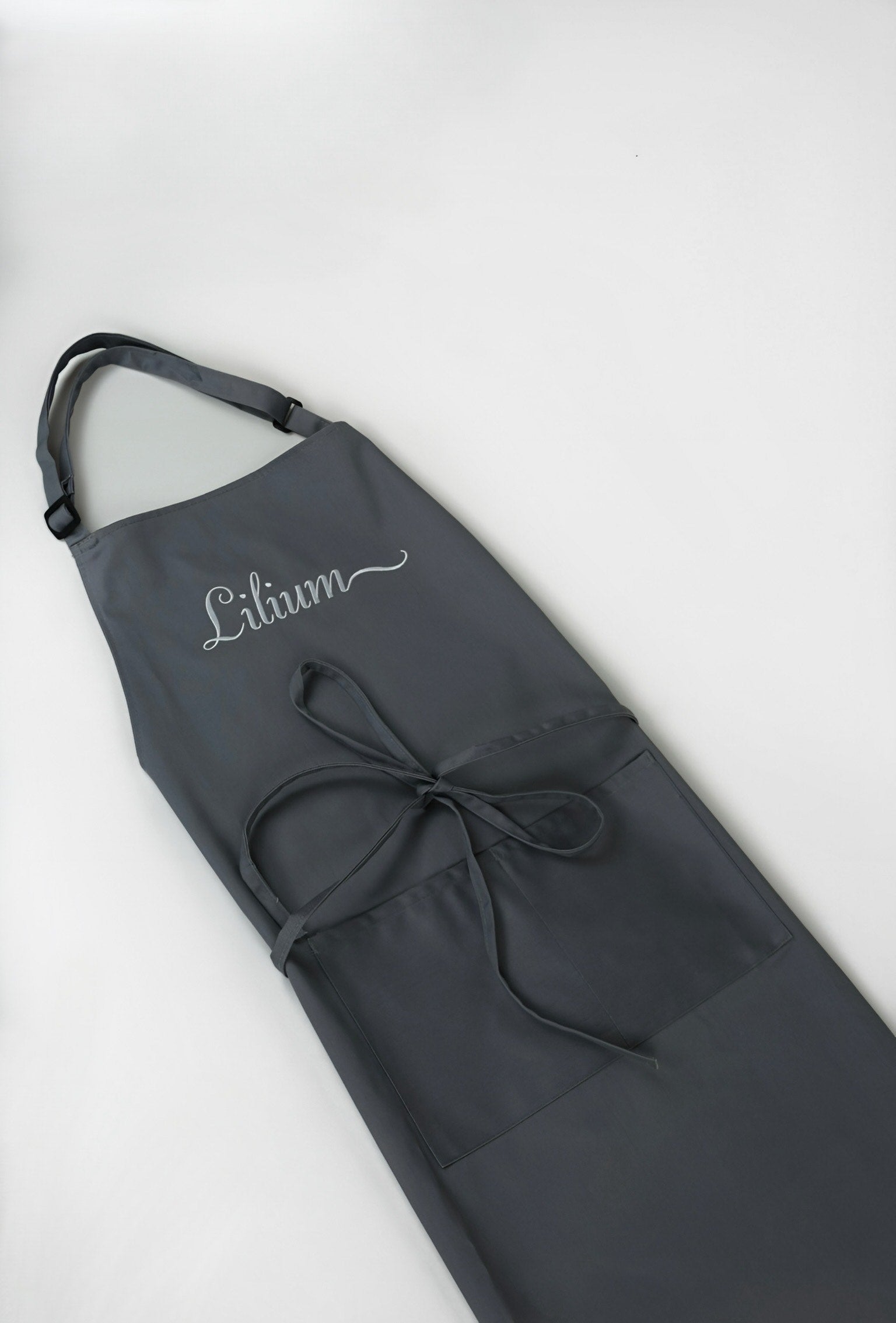 Gray apron with 'Lithium' embroidery on a white background