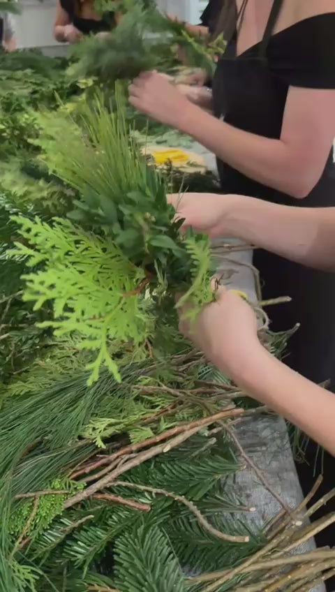 Video of a group making Christmas wreaths in an in-studio wreath making workshop